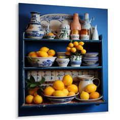 a blue shelf filled with bowls and oranges