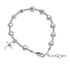 "This timeless keepsake rosary bracelet is designed and hand-beaded in the USA and made using only the finest materials such as 100% sterling silver components, glass pearl hearts, and adorned with an intricate sterling silver cross charm. Each comes boxed in a beautiful gift box and makes a special keepsake for her special first communion day! (6 - 6.5\" with adjustable extension chain). FREE STANDARD SHIPPING - ships within 1 business day! Matching Earrings: https://etsy.me/2YZQZuy Want to add Nickel Free Silver Rosary Bracelet For Gift, Silver Beaded Jewelry For Baptism, Silver Beaded Rosary Bracelet For Gift, Silver Beaded Rosary Bracelet Gift, Silver Spiritual Bracelet With Heart Beads, Adjustable Hypoallergenic Silver Rosary Bracelet, Silver Round Beads Jewelry For First Communion, Adjustable Silver Beaded Heart Bracelet, Adjustable Sterling Silver Charm Bracelet With Heart Beads