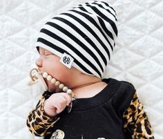 Our beanie is handmade with knit soft fabric that is stretchy and comfy. Black and white hipster slouchy beanie. Perfect for girls or boys. Sizes Small 0-6 months Medium 6-12 months Large 12m-2 year Xlarge 2-10 year Xl width 19in length 9in L width 18 in length 8in M width 16in length 8in S width 14in length 7in Width is measured for the head size Item listed only, no accessories included Slouchy Knit Hat, Hipster Beanie, Beanie Black, Unisex Baby Clothes, Slouchy Beanie, Gender Neutral Baby Clothes, Style Expert, Knit Hat, Unisex Baby