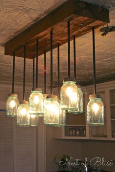 mason jar chandelier with lights hanging from the ceiling