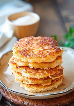 a stack of pancakes sitting on top of a white plate