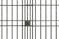 an image of a jail cell with bars on the sides and a square hole in the middle