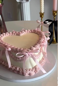 a heart shaped cake sitting on top of a table