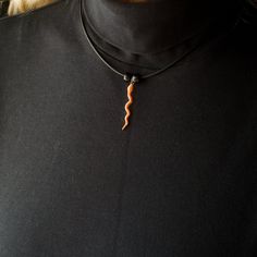 "I loved designing this pretty corn snake necklace! It is a detailed design, painted with shimmery orange translucent paint. The snake pendant measures 1 1/2\" long and is 1/8\" wide. Your Magic Zoo pewter necklace will come ready to wear on an 18\" cord with a lobster clasp. It will include 2 glass beads. Your Magic Zoo enamel necklace will come ready to wear on an 18\" cord with a lobster clasp. It will include 2 glass beads. If you would care for a different color bead than the one in the pho Adjustable Orange Choker Jewelry, Unique Adjustable Snake Chain Necklace, Unique Orange Pendant Necklace, Orange Choker Jewelry For Gift, Orange Choker Necklace For Gift, Adjustable Orange Necklace For Gifts, Adjustable Orange Necklace For Gift, Handmade Orange Choker For Gifts, Handmade Orange Choker As Gift