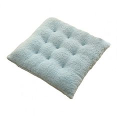 a light blue square cushion on a white background