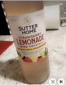 a bottle of lemonade sitting on top of a counter