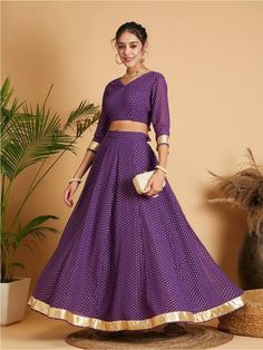 Please check the last image for a detailed size chart Purple and beige printed lehenga choli, Purple and beige printed ready to wear blouse, has a v-neck, three-quarter sleeves Purple and beige printed ready to wear lehenga, has slip-on closure, flared hem Material & Care Poly Georgette Hand Wash Pattern: Embellished Style: Lehenga Choli Occasion: Wedding, Engagement Dispatch within 7 days Semi-stitched Formal Choli For Navratri, Formal Semi-stitched Choli For Navratri, Formal Unstitched Blouse Sets For Navratri, Formal Sets With Unstitched Blouse For Navratri, Maxi Length Lehenga For Formal Festive Occasions, Formal Festive Lehenga With Maxi Length, Formal Maxi Length Lehenga For Festive Occasions, Formal Semi-stitched Maxi Length Lehenga, Formal Semi-stitched Lehenga