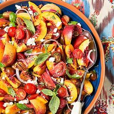 a bowl filled with sliced peaches, onions and feta on top of a table