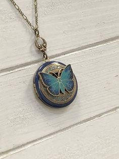 Butterfly 🦋 vintage antique brass Locket Pendant - hand painted. Butterfly is the power of air, the ability to float upon a breeze. It is known for its darting flight; thus, it represents the mind and our ability to change it when necessary. Butterfly represents the never-ending cycle of life; therefore, its medicine bestows not only the ability, but the clarity of mind needed before self-transformation. Butterflies appear to dance as they flitter among the flowers. They remind us not to take t Blue Enamel Locket Jewelry, Enamel Locket Jewelry For Anniversary, Victorian Enamel Locket Jewelry, Turquoise Locket For Wedding Jewelry, Turquoise Locket Jewelry For Wedding, Turquoise Wedding Locket Jewelry, Unique Antique Finish Jewelry For Wedding, Antique Enamel Locket Jewelry, Antique Enamel Jewelry For Anniversary