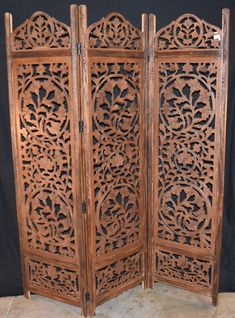 an old wooden screen with intricate carvings on it