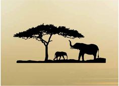 an elephant and her baby are silhouetted against the sunset sky in this image, two elephants stand under a tree