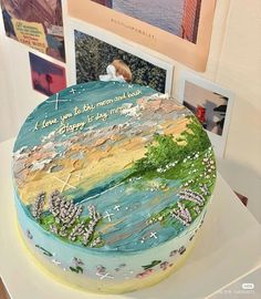 there is a cake that has been decorated with pictures and words on the top layer