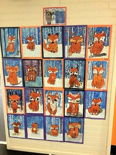 a bulletin board with pictures of foxes and other animals on it's front wall