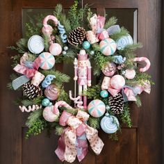 a wreath with candy canes and ornaments on it