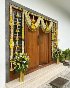 the front door is decorated with yellow flowers