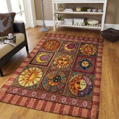 an area rug with sun and moon designs on it in the middle of a living room