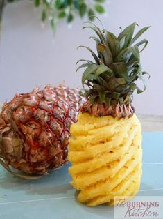 two pineapples are stacked on top of each other