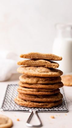 a stack of cookies sitting on top of a cooling rack