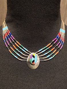 Vintage Zuni Sterling Silver Five-Strand Necklace with Multi-Stone Inlay Pendant & Matching Stud Earrings. Features a variety of materials including liquid sterling silver beads, turquoise, coral, lapis, onyx, spiny oyster, malachite, and jasper. Marked Sterling. Excellent pre-owned condition; appropriate for age. 21g total (16g necklace; 5g earrings) Stroudsburg Pa, Zuni Jewelry, Native Beadwork, Stone Inlay, Spiny Oyster, Multi Stone, Strand Necklace, Sterling Silver Bead, Turquoise Jewelry