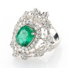 An Edwardian era inspired ladies ring, combining filigree design and a set of petite diamonds with a lovely green emerald.   Metal 18k / 0.585 gold Gemstones 1 emerald 2.32ct 64 diamonds 1.0ct (H/SI) Measurements Head 28.0mm Shank 3.9mm Ring size 6.5 US Weight 8.9g Condition Excellent condition General Information All items come with certificate of authenticity, gemstones have been tested at our lab if not otherwise indicated. Pendants are shown with chain for decorational reasons, please note t Luxury Green Emerald Ring With Rose Cut Diamonds, Luxury Green Rings With Single Cut Diamonds, Fine Jewelry Emerald Ring With Intricate Design, Silver Emerald Ring With Pave Setting, Luxury Emerald Ring With Pave Setting, Luxury White Gold Emerald Ring With Rose Cut Diamonds, Formal Emerald Ring With Pave Diamond Setting, Formal Emerald Diamond Ring With Pave Setting, Exquisite Diamond Emerald Ring With Pave Setting