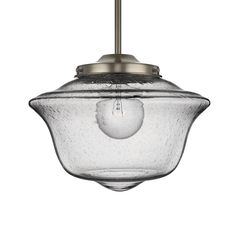 a glass light fixture hanging from the ceiling