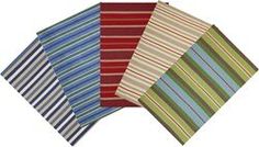 four different colored striped napkins sitting on top of each other