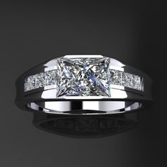 a princess cut diamond ring with channel set diamonds