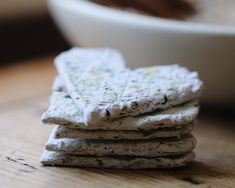 a stack of crackers sitting on top of a wooden table