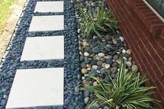 a walkway made out of stones and gravel