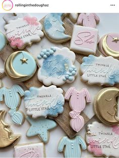 some cookies that are sitting on top of each other in different colors and designs, with the words twinkle little star next to them