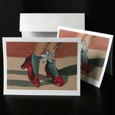 two cards with red shoes and bows on them