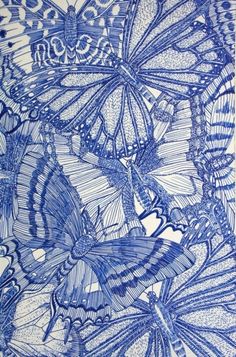 a drawing of blue butterflies on white paper