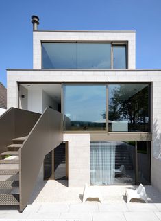 a modern house with stairs leading up to it