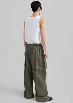 Color: Khaki  Midweight cotton fabric Relaxed fit Wide leg Large front pockets  Large back pockets Elasticated waist with a drawstring Slip-on style Unlined 100% Cotton Dry Clean By The Frankie Shop. Imported Drawstring Cargo Pants, The Frankie Shop, Frankie Shop, Color Khaki, Cargo Pants, Wide Leg, Cotton Fabric, Dry Clean, Slip On