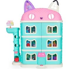 a toy doll house with a cat on the roof and two floors, in front of a white background