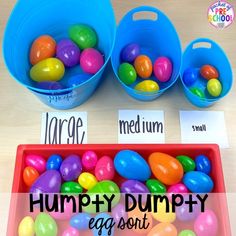 two buckets filled with colorful eggs and the words humpty dumppy egg sort