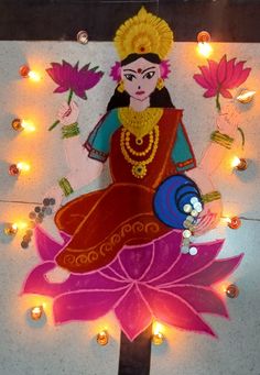 a painting on the wall with lights around it and a woman holding flowers in her hand