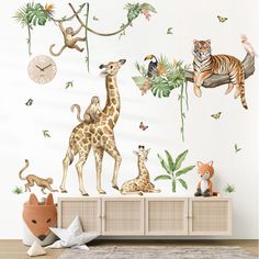 an animal themed wall decal in a children's room with jungle animals and birds