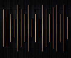 an abstract black and gold background with vertical lines