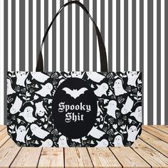 This spooky season, make sure you're ready to transport all your ghostly needs with this Ghoulishly Glamorous Ghost Spooky Shit Weekender Tote Bag. With its fun black lining and handles, this tote is perfect for packing up all your spooky shit for weekends away! (Don't worry, no ghosts included). DETAILS Measures – 24" x 13" (60.9 cm x 33 cm) Features black interior lining and black handles Assembled and printed in the USA Please allow a size tolerance of +-0.75 MADE TO ORDER Each bag is custom Black Novelty Bag For Everyday Use, Black Rectangular Bag For Halloween, Rectangular Black Bag For Halloween, Spooky Black Halloween Bags, Spooky Black Bags For Halloween, Novelty Black Halloween Bags, Novelty Black Bags For Halloween, Black Large Capacity Bags For Halloween, Large Capacity Black Bag For Halloween