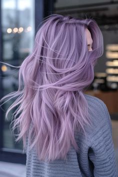 Feel like a snow queen with these 15 enchanting winter hair colors. From icy blondes to snowy silvers, get ready to dazzle. Silver Purple Pink Hair, Icy Lilac Hair, Icy Lavender Hair, Colorful Hair Inspiration, Lavender Hair With Bangs, Smoky Lilac Hair, Icy Purple Hair, Icy Purple Blonde Hair, Purple Hair Color Ideas For Blondes