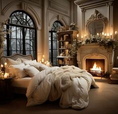 a large bed sitting next to a fire place in a room with lots of windows