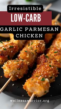 grilled low carb garlic parmesan chicken skewers on a black plate