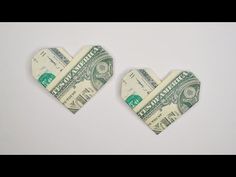 two hearts made out of money sitting on top of each other