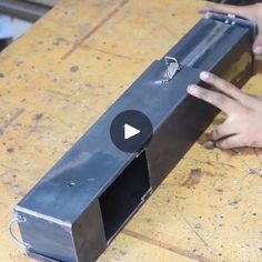 a person is working on an object in the process of making something out of metal