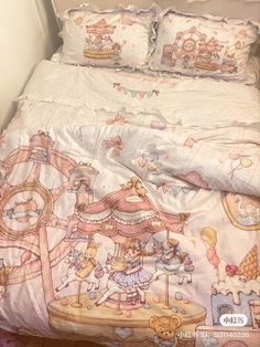 an image of a child's bed with pink and white comforter set on it