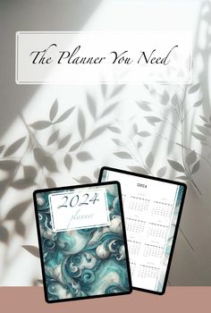 the planner you need is next to a calendar on a table with leaves in it