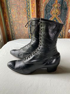 These classic suffrage era shoes are in marvelous shape for their age. With a profile of an ankle high bootie, the lace up, pointed toe styling is identified as a "must have" for authentic women's costuming for historic correctness. I find both shoes to be in comfortable, wearable condition. The soft leather has significant wear on the tongue, but still laces well and feels comfortable to use. It fits my size 7.5 generously, although I do have a naturally slim foot and would call them a "narrow" size. The real stacked leather heel and heavy leather sole also have significant wear, with one shoe probably needing repair within a season of use. If used for rare costume dates (my recommendation for antique leather)  these shoes should last through quite a few fantastic dressy events. 1910 Shoes, Wednesday Shoes, Shoe Costume, Witch Shoe, Witchy Fall, Antique Shoes, 1920s Shoes, Historical Shoes, Granny Boots