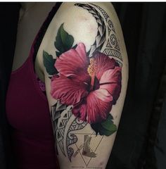 a woman's arm with a pink flower tattoo on the left side of her body