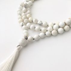 White Turquoise Mala This mala is made of 108 8mm faceted White Turquoise beads and measures 40 inches in length. It is best used for meditation, praying, or to obtain peace. For more necklaces, click here: http://etsy.me/1WMWiZL Shop's Homepage: GenuineBeadShop.etsy.com Before purchasing, make sure you read through our shop's policy. If you have any questions or want a custom order (different size, color), feel free to contact us on the Etsy convo or our email at thegenuinebeadshop [!at] gmail. White Adjustable Mala With Gemstone Beads, Adjustable White Mala With Gemstone Beads, Adjustable White Gemstone Beads Mala, Adjustable Howlite Beaded Necklace, Elegant White Beaded Necklace For Meditation, Beaded Howlite Necklaces With Round Beads, Elegant Mala With 108 Beads For Meditation, Howlite Gemstone Beads Necklace, Elegant White Mala As Gift